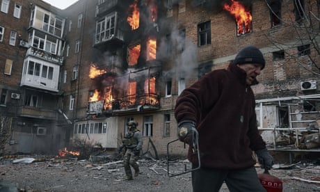 A resident leaves his home after Russian shelling destroyed a block in Bakhmut this week.