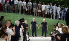 Giorgio Armani, right, and longtime collaborator Leo Dell’Orco acknowledge the applause of the audience.
