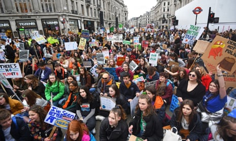 Climate protesters bring London’s Oxford Circus to a standstill on Friday.