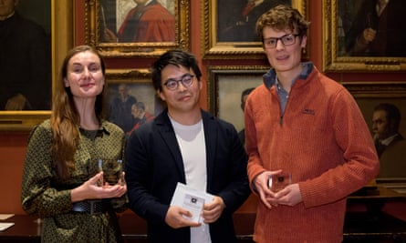 Luke Hallam, right, with his fellow runner-up, Cerise Louisa Andrews, left, and this year’s winner En Liang Khong at the Burgess prize award ceremony.