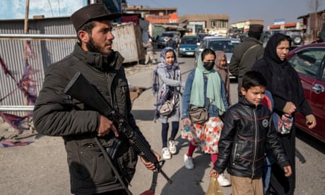 A Taliban fighter stands guard in Kabul
