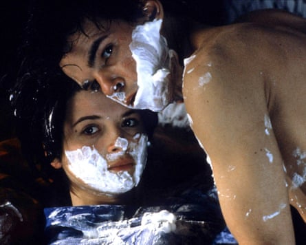 Man and woman with shaving foam on faces