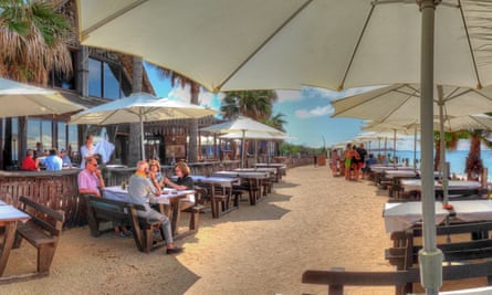 Sajorami Beach, Zahora, Cadiz a few people drinking at tables.