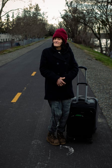 reyes poses with suitcase