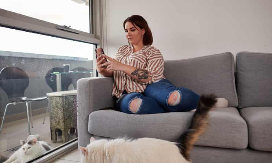 Mia looks at her phone