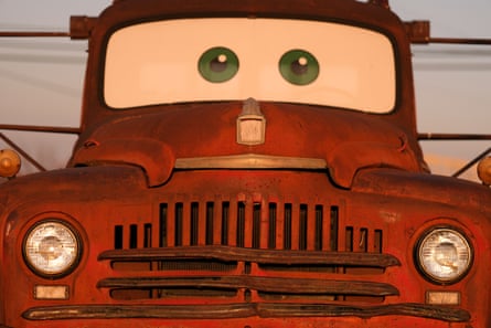 An old tow truck with eyes on the windshield to look like Tow Mater in the movie Cars