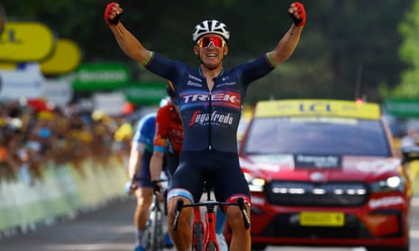 Mads Pedersen celebrates as he crosses the finish line in Saint-Étienne.