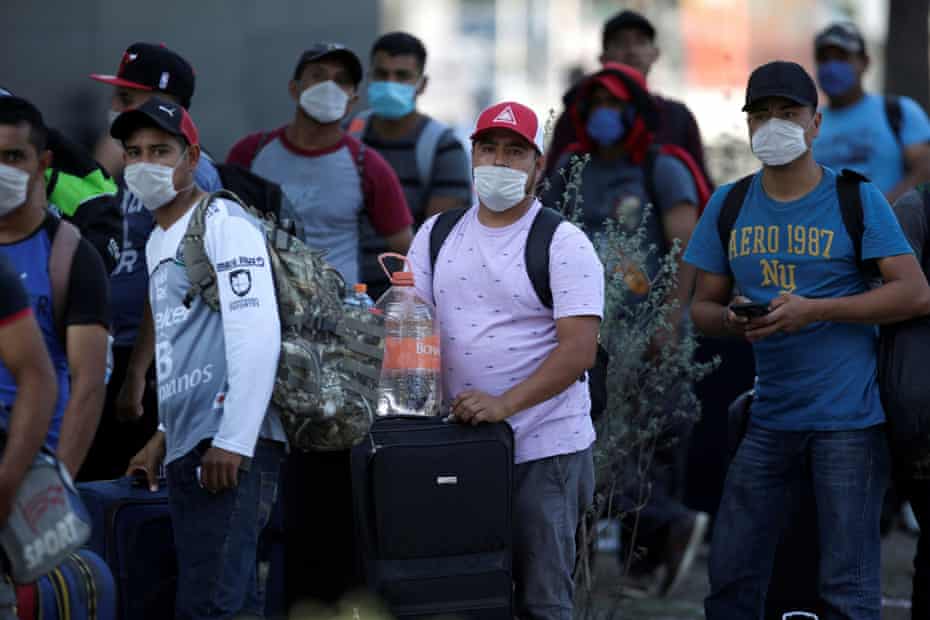 Migrants seeking a U.S. work visa are pictured after being evicted from their hotel, which local authorities said was crowded, as part of the measures to prevent the spreading of the coronavirus disease in Monterrey, Mexico.
