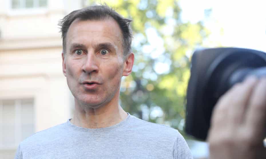 Jeremy Hunt speaking to reporters after his morning run in London on Thursday.