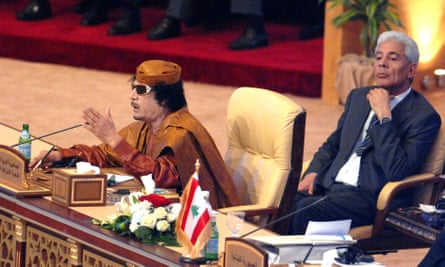 Muammar Gadaffi (left) with Moussa Koussa at the 21st Arab League leaders summit in Qatar in 2009.