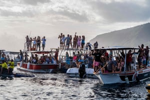 Spectators are seen on boats as they watch the Outerknown Tahiti Pro 2022, the WSL Championship Tour, Teahupo’o, French Polynesia