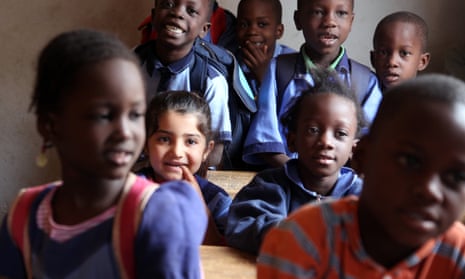 Nadim Ahmed, second left, the daughter of Syrian refugees, continues her education at a school in Bamako.