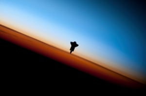 The space shuttle Endeavour is silhouetted against the backdrop of Earth’s horizon prior to docking with the International Space Station in this picture taken by an Expedition 22 crew member on February 9, 2010 and released by NASA February 12, 2010. REUTERS/NASA Handout (UNITED STATES - Tags: SCI TECH IMAGES OF THE DAY) FOR EDITORIAL USE ONLY. NOT FOR SALE FOR MARKETING OR ADVERTISING CAMPAIGNS - GM1E62D1J0801