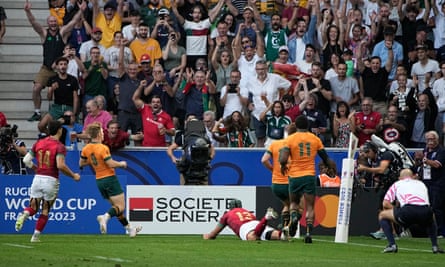 Portugal’s Pedro Bettencourt dives to score a try against Australia