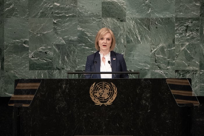 Liz Truss at a lectern