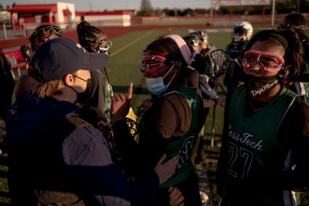 Senior captain, Alexia Carrol-Williams, 17, talks with Coach Summer Aldred after the first half during the game between Cass Tech and Chippewa Valley in Clinton Township, Michigan on April 30, 2021. Cass Tech took their second win of the season 14-6.