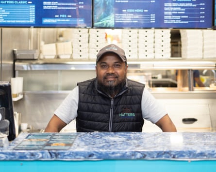 Tanner Ahmed at the counter of his fish and chip shop