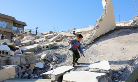 A child on a collapsed building at Darbandikhan, Sulaymaniyah, Iraq on Monday after northern Iraq and Iran were hit by a 7.3 magnitude earthquake.
