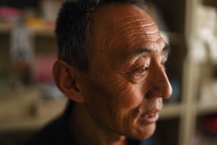A headshot of Wang Bingbing, who still has a scar on his forehead from a coalmine injury
