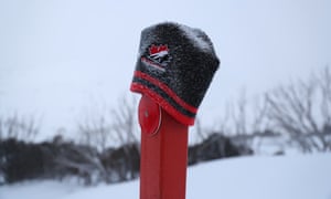 A lost beanie on a road-side marker at Guthega in NSW after days of blizzard in the Australian alps.
