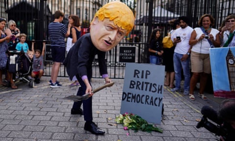 A protester dressed as British PM Boris Johnson