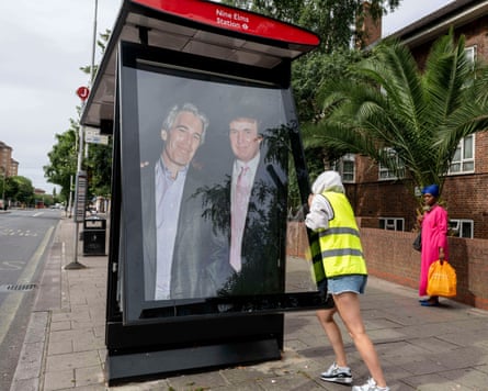 Woman in high vis jacket installing poster at bus stop