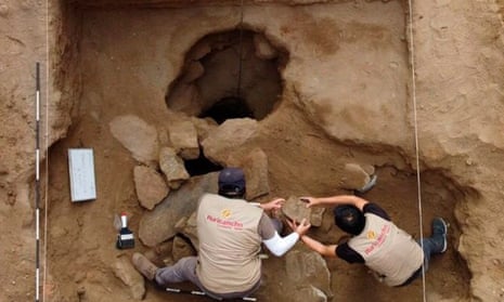 Archaeologists in the tomb in Lima, Peru