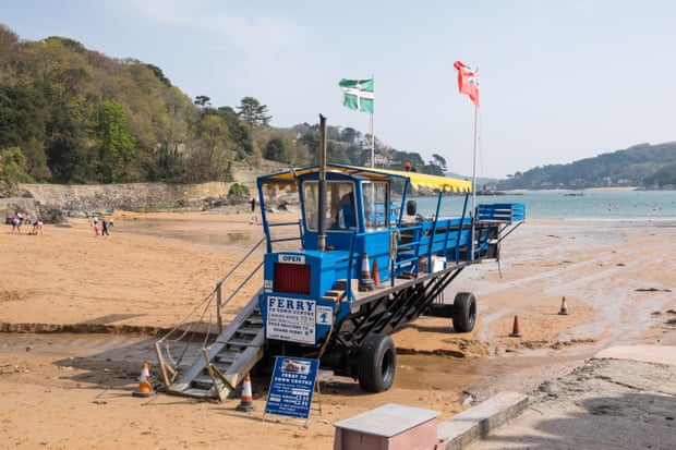 The sea tractor carries passengers from the beach at South Sands to the ferry to Salcombe in South Hams, Devon, UK