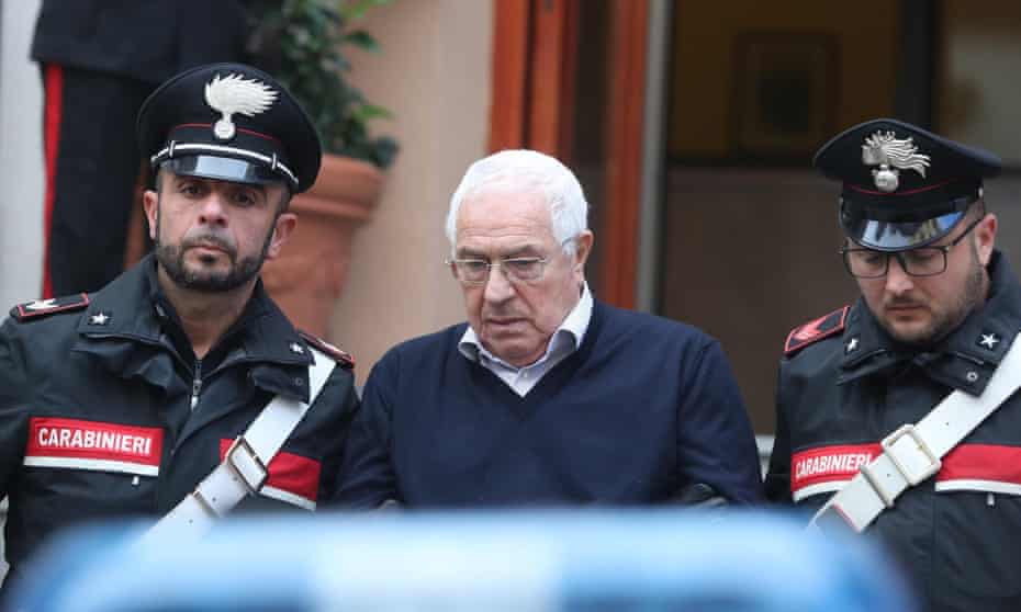 Settimo Mineo is escorted by Italian police officers after his arrest in Palermo