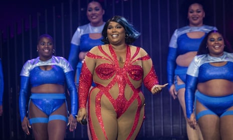 Lizzo on stage with backup dancers