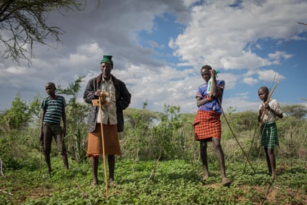 Pokot herders stand in a community pasture reserved for the dry season nearby the town of Loruk