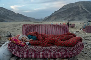 An Afghan refugee lying on a settee by the Torkham Pakistan border crossing in Afghanistan, 17 November 2023