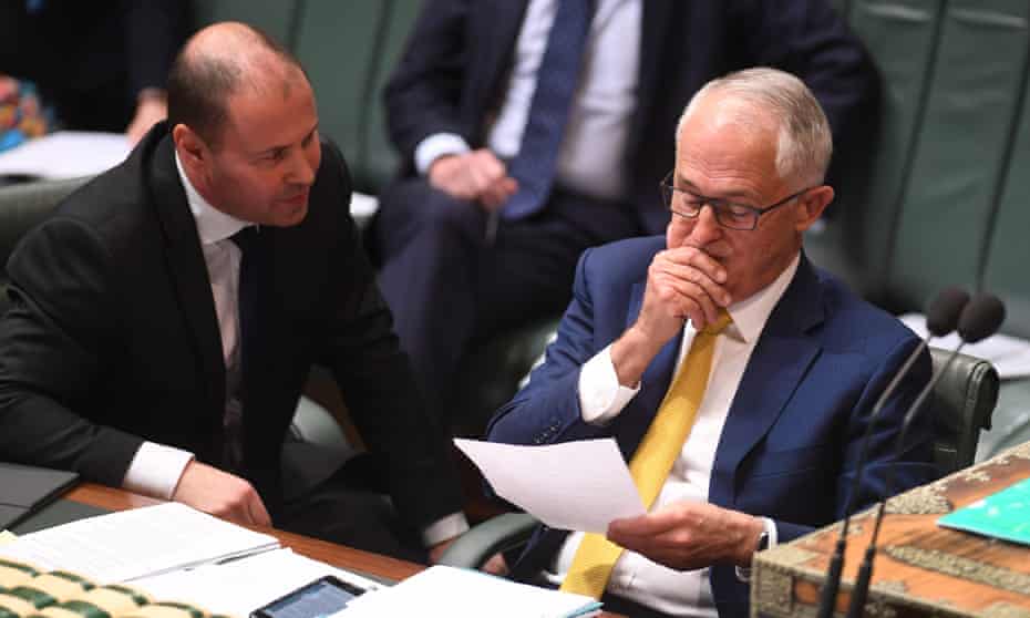 Malcolm Turnbull (right) speaks to minister for energy and the environment Josh Frydenberg on Monday
