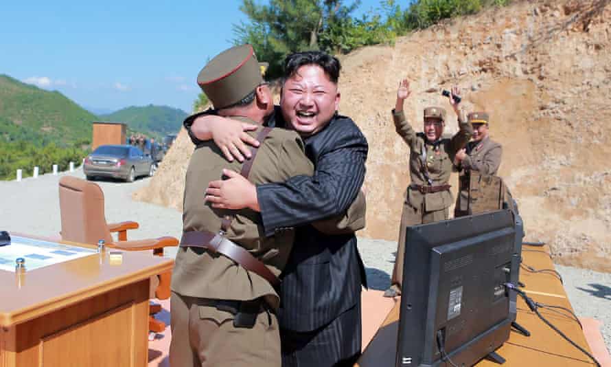 Kim Jong-Un celebrating the successful test-fire of the intercontinental ballistic missile in July.