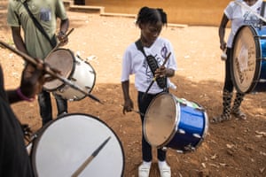 Members of the Area 10 scouts brass band practise playing the drums during a training session
