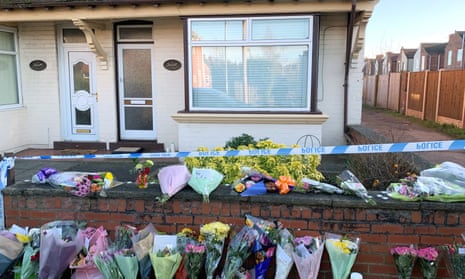 Flowers from well-wishers outside the home of Freda and Ken Walker in Langwith Junction, Derbyshire.