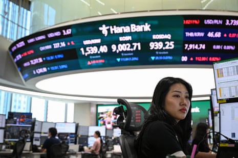Currency dealers monitor exchange rates at the Hana Bank headquarters in Seoul on 23 June.