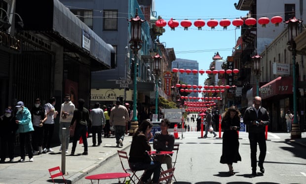 People stroll in Chinatown in San Francisco, California, on 22 May 2021. California plans to fully reopen its economy on 15 June.