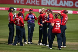 The England players celebrate taking the wicket of Smriti Mandhana.