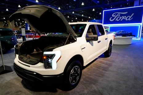 a white truck in a showroom