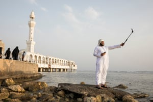 Mohammed, an Iraqi tourist from Falujah, takes a selfie outside the Floating Mosque