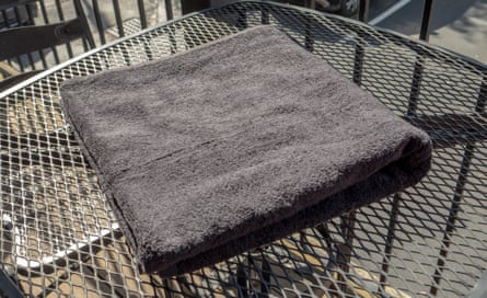 Room Essentials Everyday Bath Towel from Target on a table outside