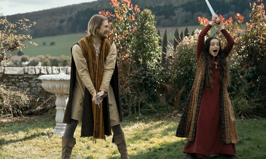 A man and a girl in medieval dress holding swords, in a scene from Lena Dunham’s new YA comedy film Catherine, Called Birdy.