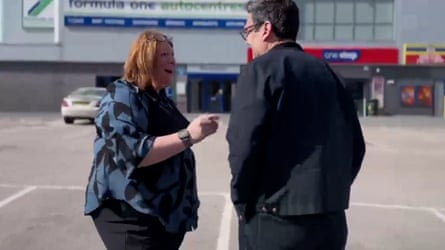 Burnham speaking to a woman in a car park