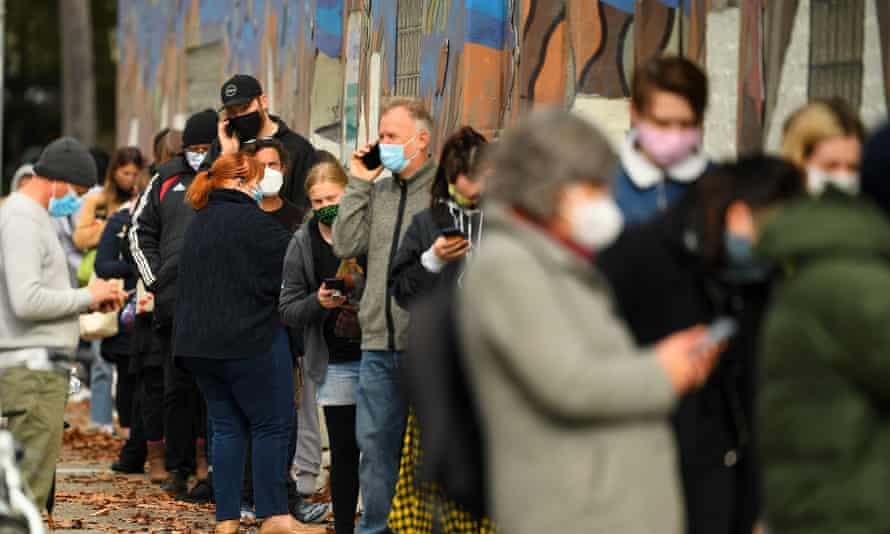 People wait in a line to receive Covid test at a walk-in testing facility in Melbourne on Wednesday.
