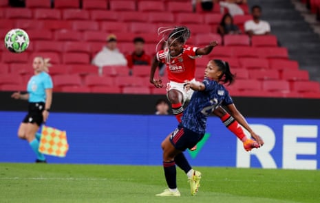 Benfica's Diana Silva gets a shot away despite the presence of Arsenal's Taylor Hinds.