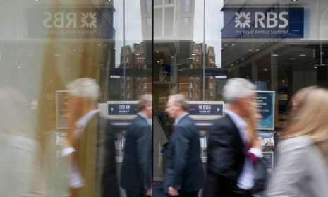 Pedestrians reflected in the glass as they pass an RBS branch in central London