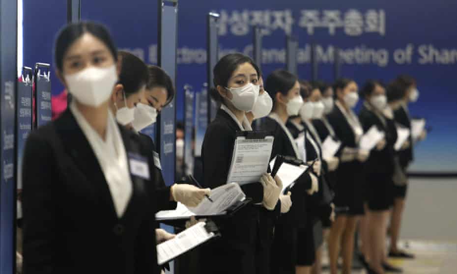 Staff in face masks at Samsung’s annual meeting in South Korea last month waiting for shareholders to arrive.