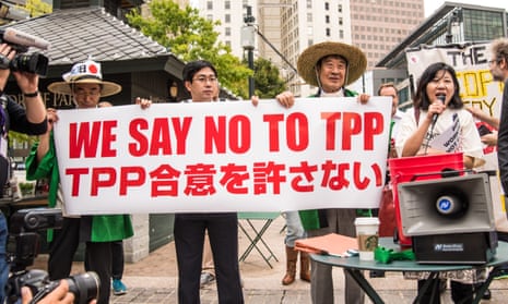 Protesters oppose Trans-Pacific Partnership trade talks in Atlanta<br>01 Oct 2015, Atlanta, Georgia, USA --- Atlanta, United States. 1st October 2015 -- At a rally in Atlanta, protesters from Japan speak in opposition to the Trans-Pacific Partnership trade agreement. -- Protesters opposed to the Trans-Pacific Partnership trade negotiations held two rallies and marches in Atlanta where the talks were being held in the Westin Hotel. Activists criticized the secrecy and the role of corporations in the negotiations. --- Image by © Steve Eberhardt/Demotix/Corbis
