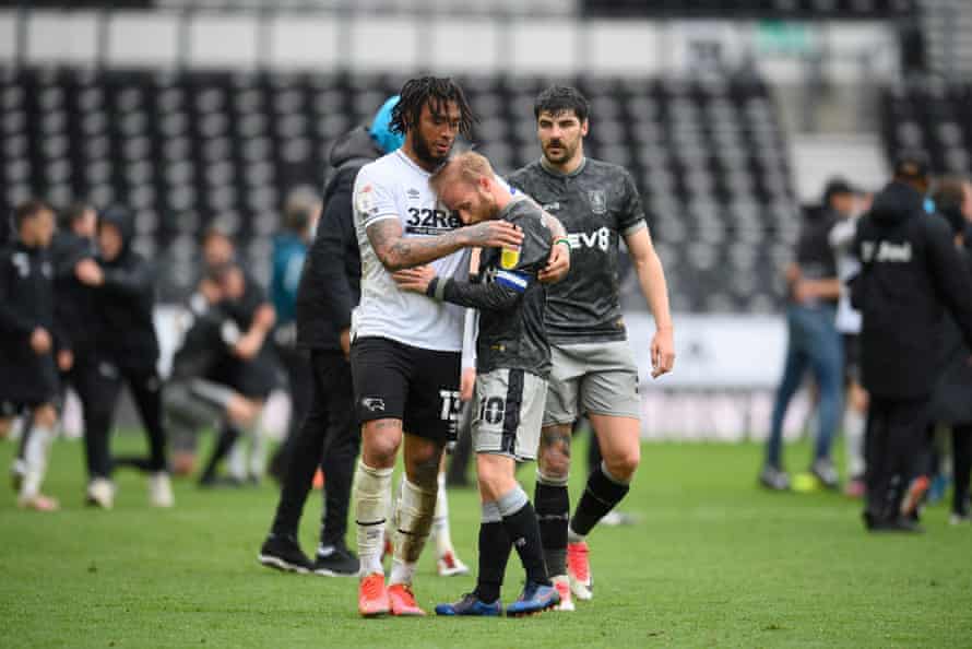 Sheffield Wednesday captain Barry Bannan is embraced by Colin Kazim-Richards after the Owls were relegated at Derby on the final day of the season.